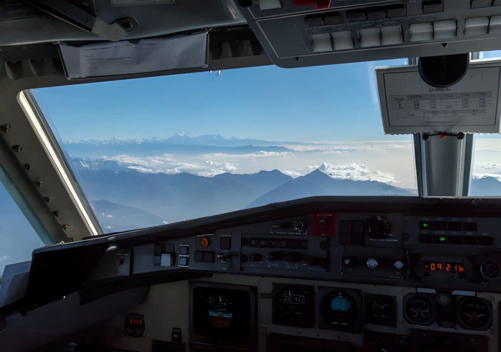 plane flying over mountains